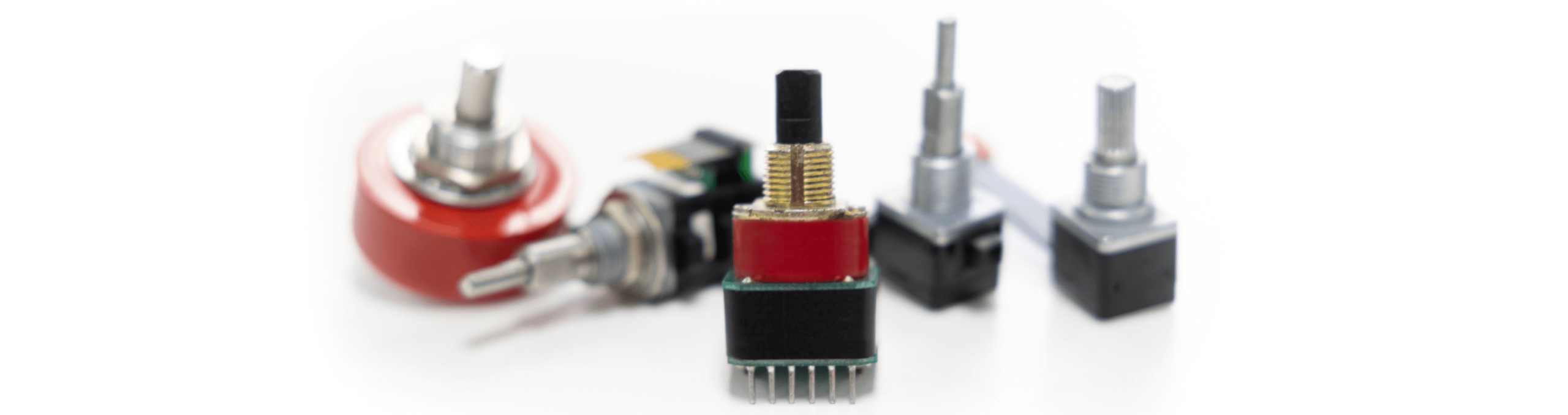 An assortment of Grayhill's precision rotary encoders and switches, showcasing the wide range of customizable options available for different human-machine interface applications.